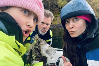 Mother and daughter and funny fish, on viking fishing adventure in sognefjord with captain Tor